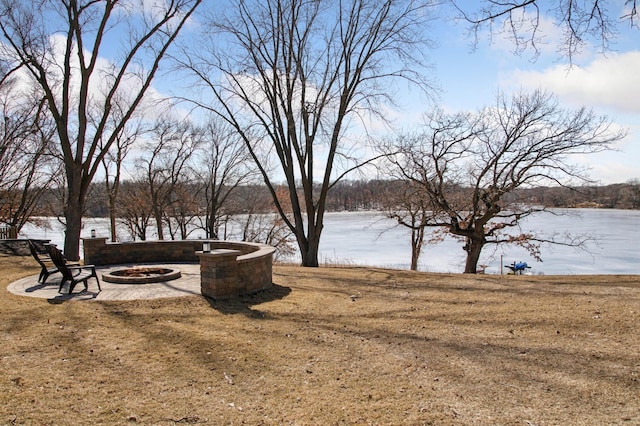 view of yard with an outdoor fire pit