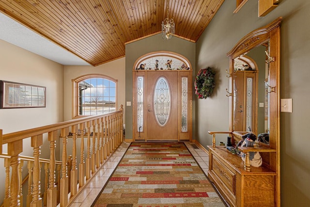 tiled entrance foyer featuring lofted ceiling and wood ceiling