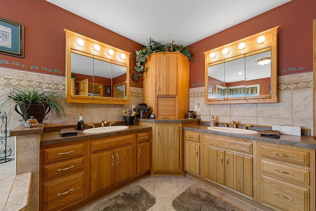 bathroom featuring tile walls, vanity, and tile patterned flooring