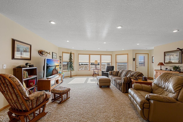 living room with light carpet and a textured ceiling