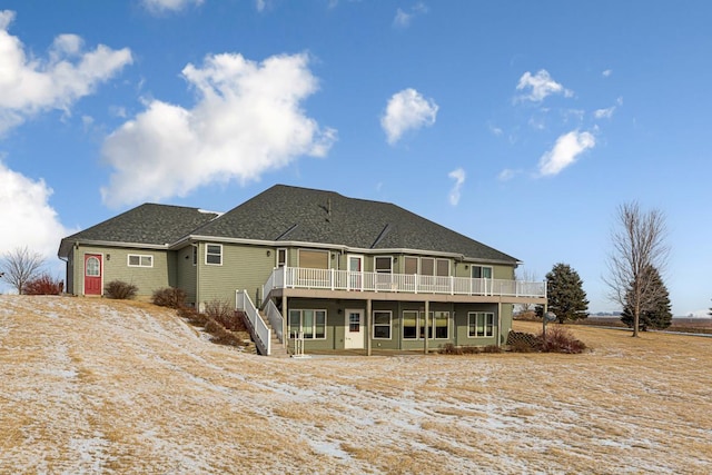 back of house featuring a deck