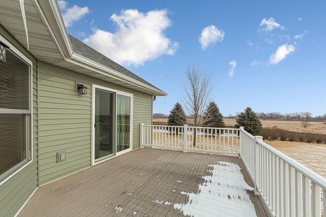 wooden terrace featuring a rural view