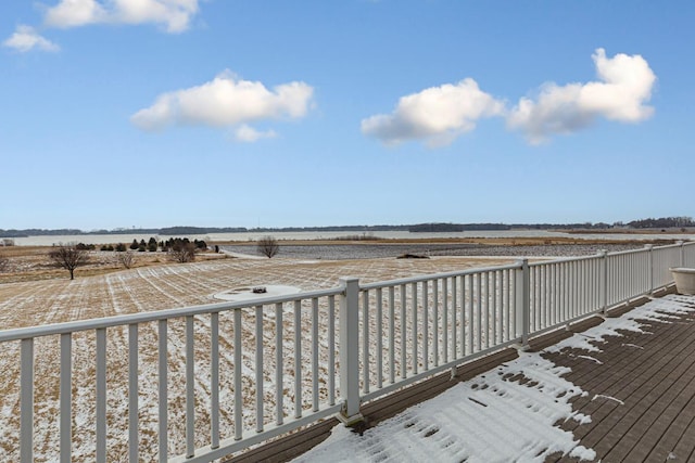 wooden terrace featuring a rural view