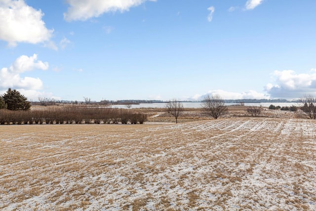 view of yard with a rural view