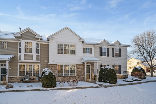 view of front of home featuring brick siding