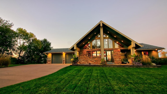 log-style house featuring a garage, stone siding, a front lawn, and concrete driveway