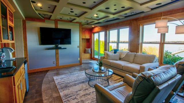 living area featuring coffered ceiling and baseboards