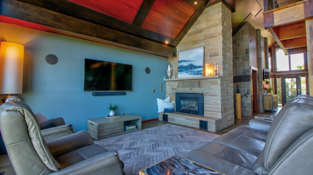 living area featuring high vaulted ceiling, wooden ceiling, a fireplace, baseboards, and beamed ceiling