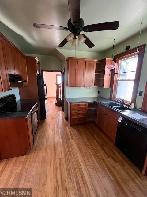 kitchen featuring ceiling fan, sink, light hardwood / wood-style floors, and black appliances