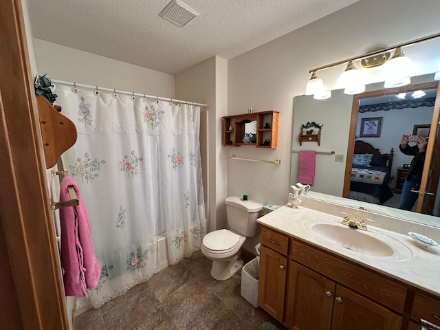 full bathroom with vanity, shower / bathtub combination with curtain, a textured ceiling, and toilet