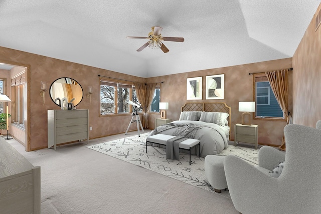 bedroom with light carpet, baseboards, ceiling fan, vaulted ceiling, and a textured ceiling