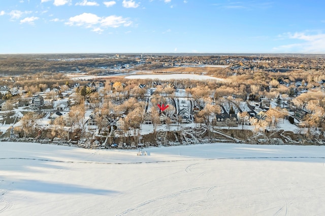 snowy aerial view with a residential view