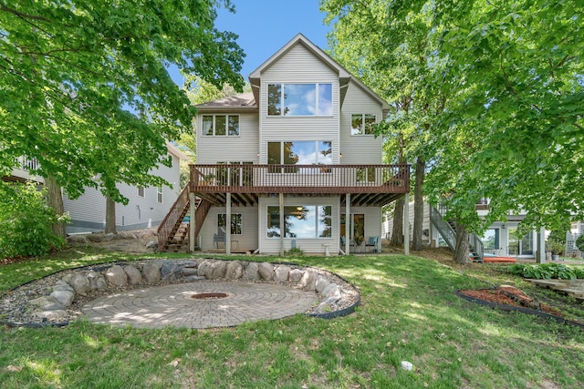 16091 Northwood Rd NW, Prior Lake, MN 55372 - rear view of house featuring a deck, stairway, a fire pit, a lawn, and a patio