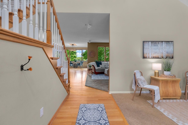 16091 Northwood Rd NW, Prior Lake, MN 55372 - corridor featuring stairs and light wood-style flooring