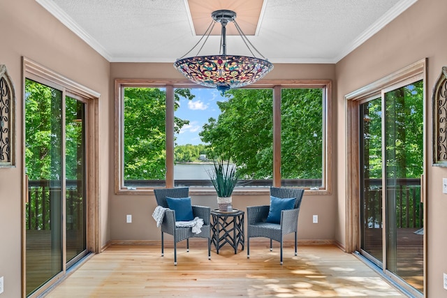 16091 Northwood Rd NW, Prior Lake, MN 55372 - sitting room featuring wood finished floors, a textured ceiling, and crown molding