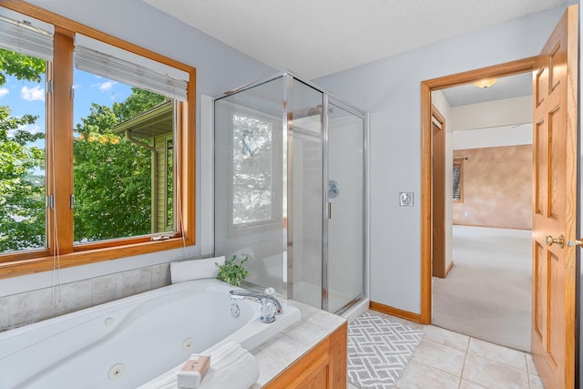 16091 Northwood Rd NW, Prior Lake, MN 55372 - full bathroom with a stall shower, a tub with jets, and tile patterned flooring