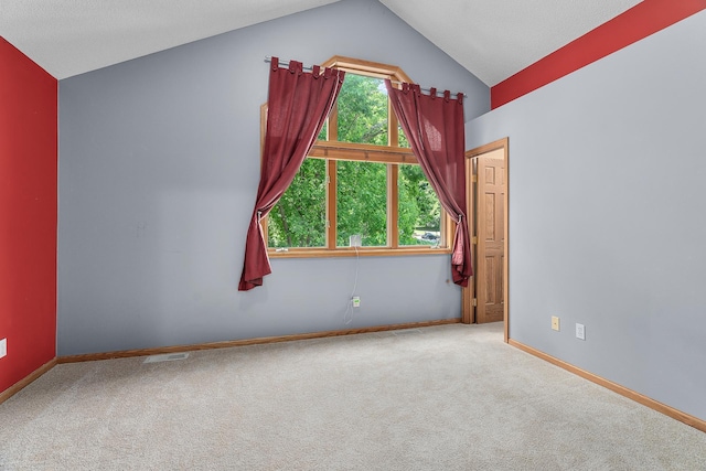 16091 Northwood Rd NW, Prior Lake, MN 55372 - carpeted spare room with vaulted ceiling and baseboards