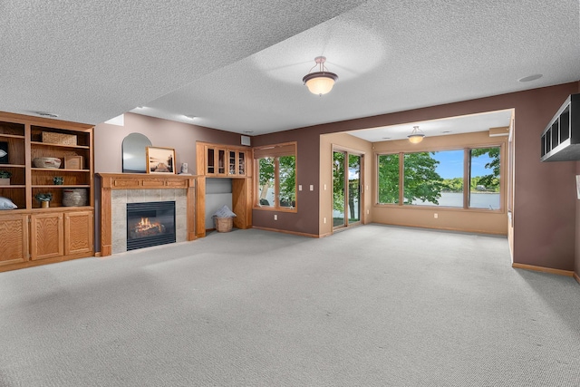16091 Northwood Rd NW, Prior Lake, MN 55372 - unfurnished living room with a fireplace, carpet flooring, and a textured ceiling