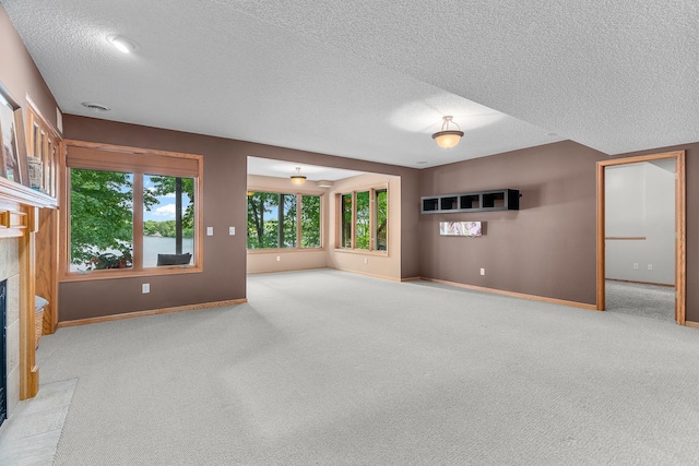 16091 Northwood Rd NW, Prior Lake, MN 55372 - unfurnished living room featuring a fireplace, a textured ceiling, and carpet