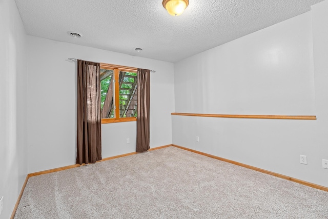16091 Northwood Rd NW, Prior Lake, MN 55372 - spare room featuring carpet flooring and a textured ceiling