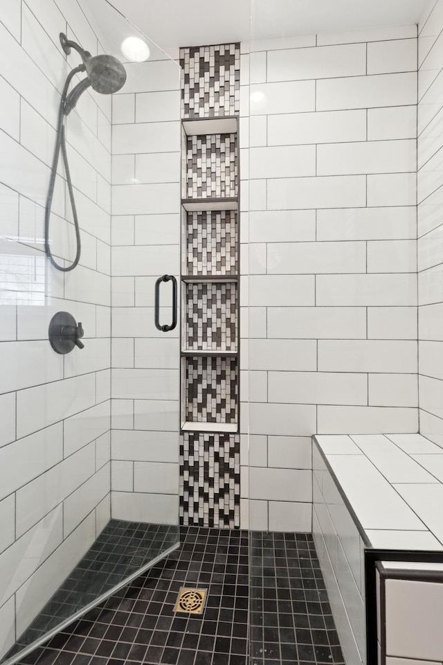 full bathroom with a tile shower