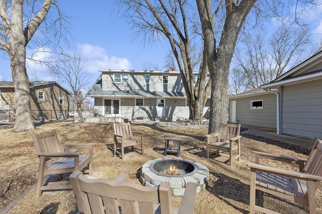 exterior space with an outdoor fire pit