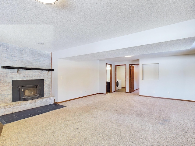 unfurnished living room with washer / clothes dryer, a textured ceiling, and dark colored carpet