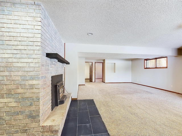 unfurnished living room featuring carpet flooring, a textured ceiling, and a fireplace