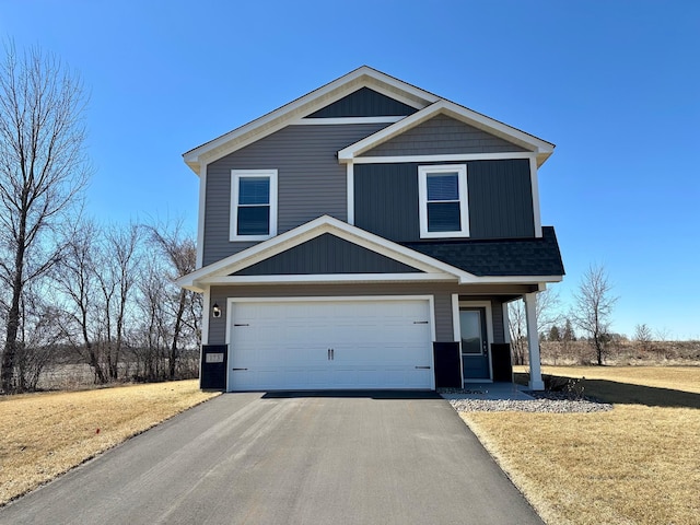 173 Summerfield Dr, Waverly, MN 55390 - view of front of home featuring a front yard, driveway, roof with shingles, and an attached garage