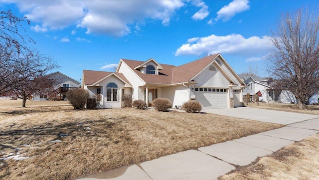 view of front of home with driveway and an attached garage