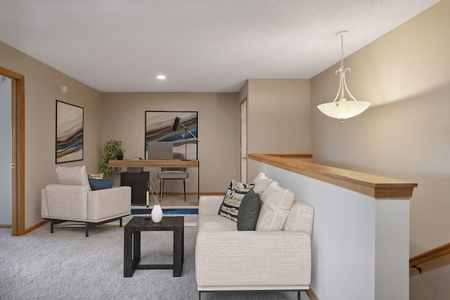 carpeted living room with a textured ceiling