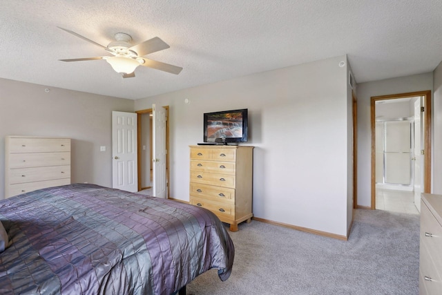 bedroom featuring ceiling fan, carpet floors, and a textured ceiling