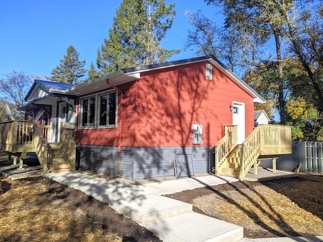 view of property exterior with fence