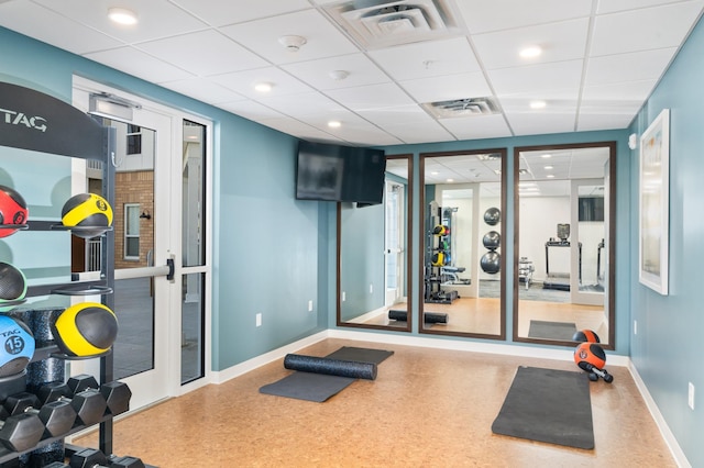 workout area featuring a drop ceiling