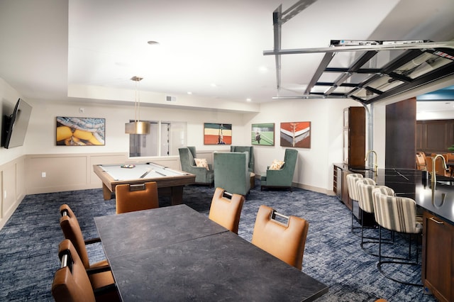 carpeted dining area featuring billiards and sink