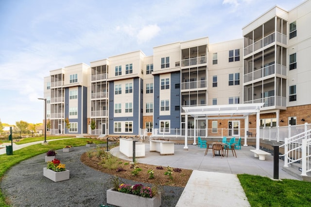 surrounding community with a pergola and a patio