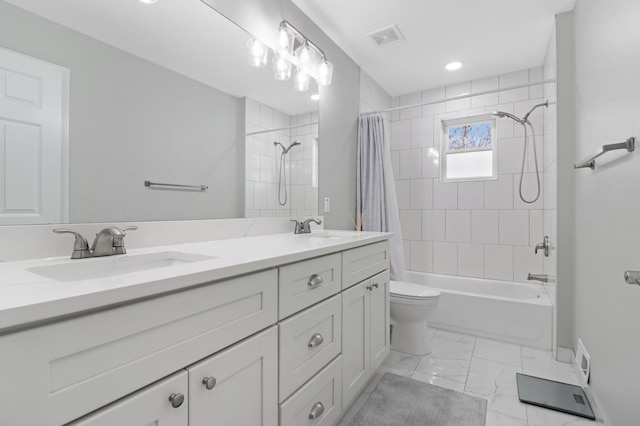 full bathroom featuring shower / tub combo, vanity, and toilet