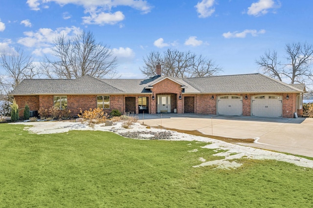 single story home with driveway, a front lawn, an attached garage, and brick siding