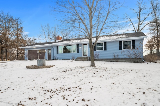 ranch-style house featuring a garage