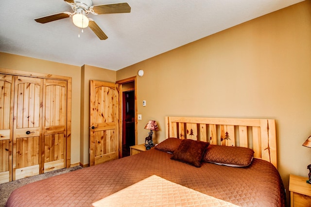 carpeted bedroom with ceiling fan