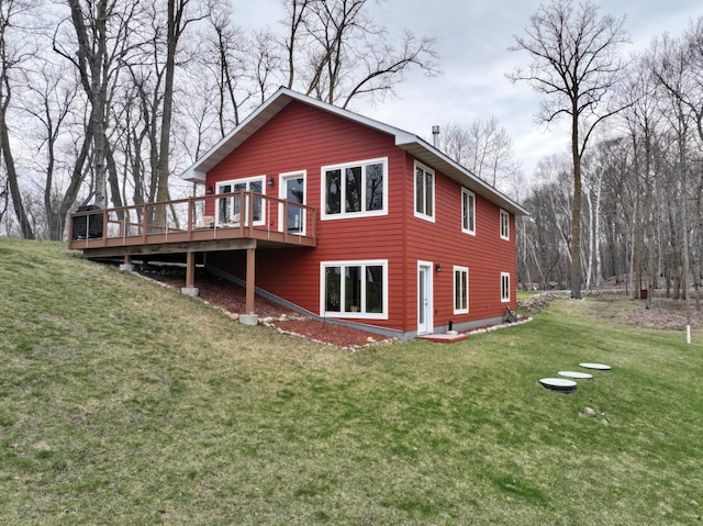 back of house with a yard and a wooden deck