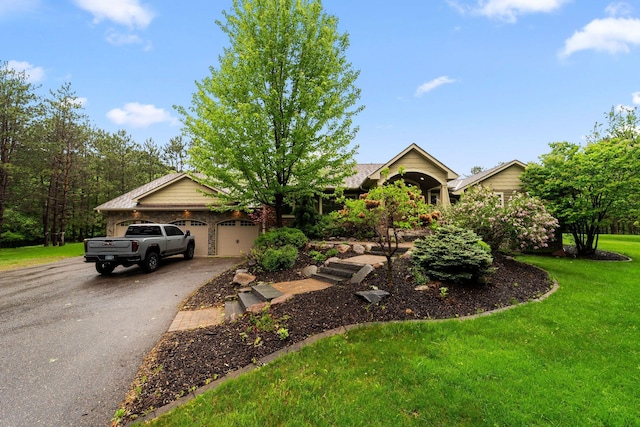 2650 Fox St, Orono, MN 55391 - view of front of home with asphalt driveway, an attached garage, and a front lawn
