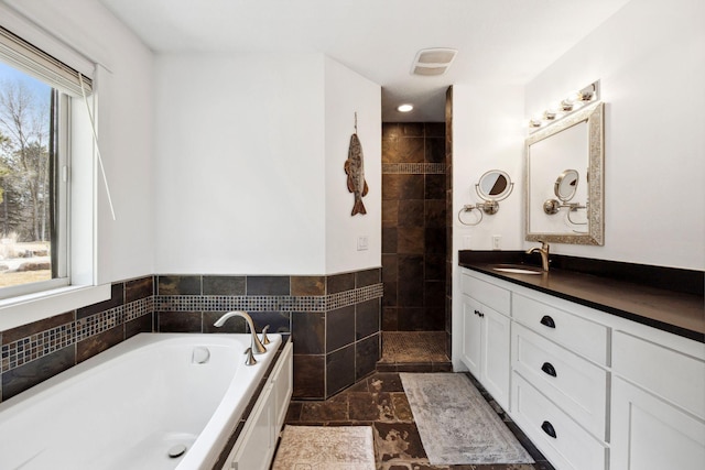 2650 Fox St, Orono, MN 55391 - bathroom featuring a garden tub, vanity, and a walk in shower