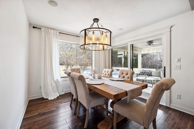 2650 Fox St, Orono, MN 55391 - dining space with dark wood-type flooring, a chandelier, baseboards, and a ceiling fan