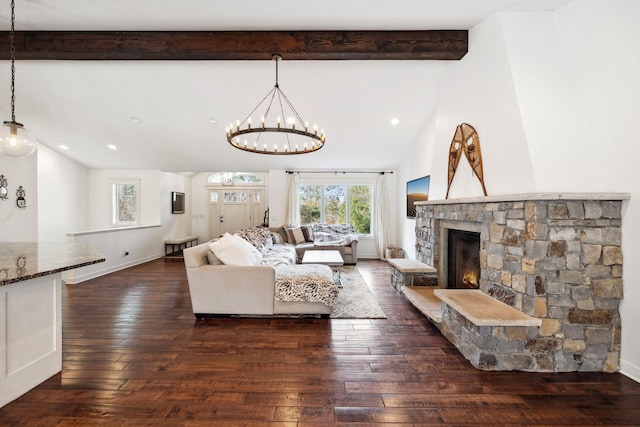 2650 Fox St, Orono, MN 55391 - living area with a chandelier, dark wood-style flooring, a stone fireplace, recessed lighting, and baseboards