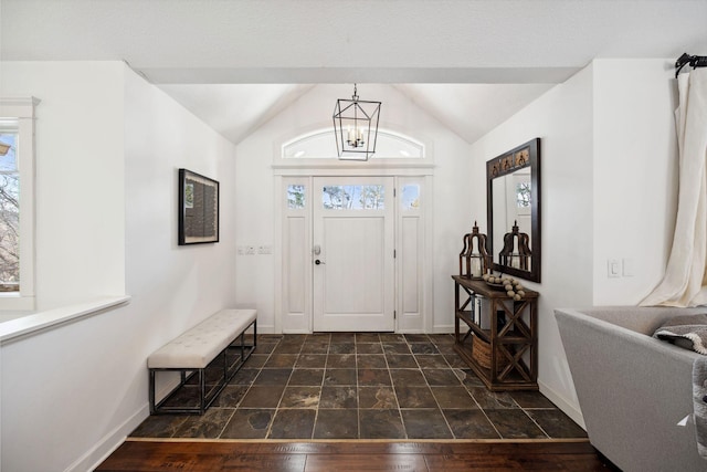 2650 Fox St, Orono, MN 55391 - entrance foyer with baseboards, a chandelier, lofted ceiling, and healthy amount of natural light