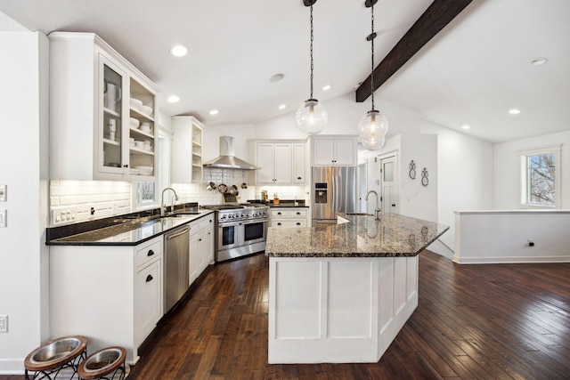 2650 Fox St, Orono, MN 55391 - kitchen featuring stainless steel appliances, wall chimney range hood, a sink, tasteful backsplash, and recessed lighting