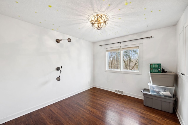 2650 Fox St, Orono, MN 55391 - empty room with wood finished floors, baseboards, and a textured ceiling