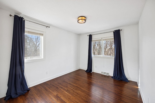 2650 Fox St, Orono, MN 55391 - unfurnished room featuring plenty of natural light, wood finished floors, and baseboards