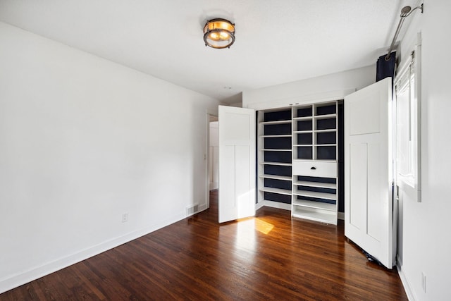 2650 Fox St, Orono, MN 55391 - unfurnished bedroom featuring dark wood-style floors and baseboards